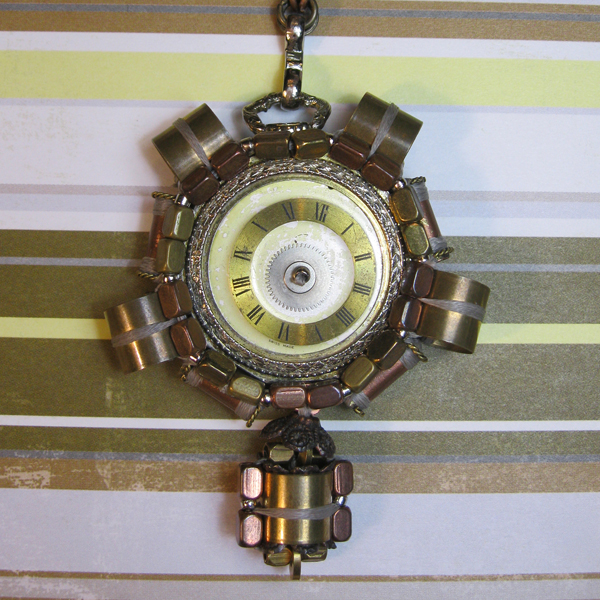 Beaded Steampunk pendant with beads woven in a frame around a pocketwatch clock face with more beads dangling