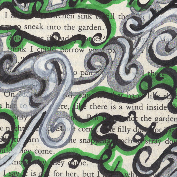 Paintmarkers, ink pens and markers used to cover up unwanted text on a page in a printed fiction book